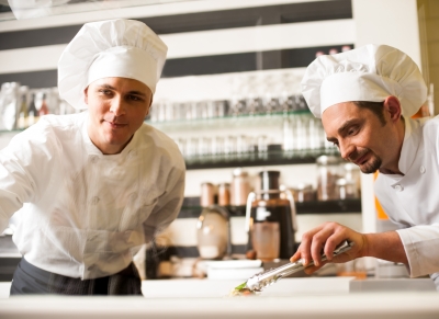 Chef Watching His Assistant Arranging Dish by stockimages ID-100276541